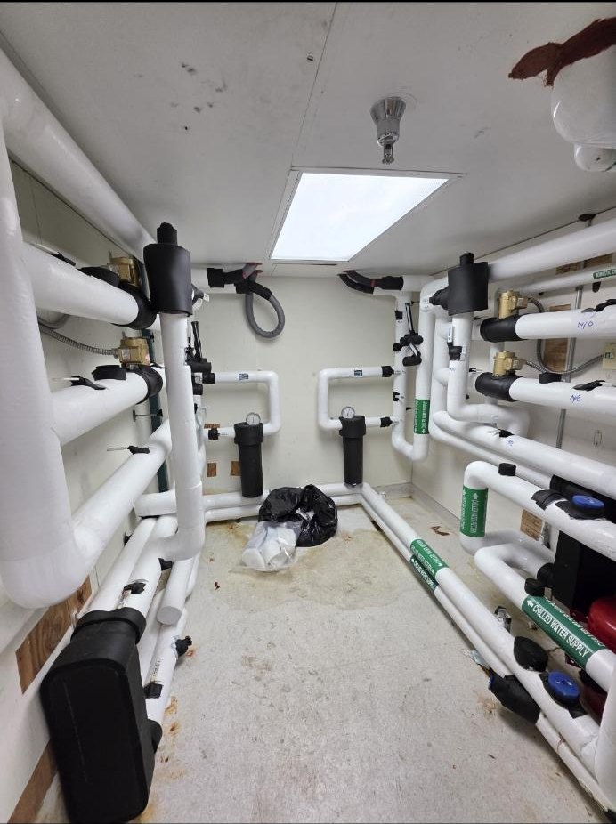 PVC manifolds and filters in a mechanical room